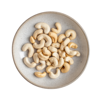 Cashews arranged in a modern ceramic plate on a soft transparent background, Cashews in modern ceramic plate beautiful shape on transparent background png