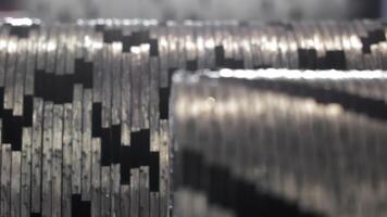 Close-up view of interlocking metal cutting teeth arranged in staggered pattern, Industrial steel shredder blades aligned for heavy-duty mechanical processing video