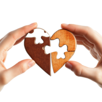 Hands connecting two pieces of a wooden puzzle heart against a transparent background, Hands matching two parts of puzzle heart, isolated on transparent png