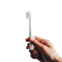 Person holds a toothbrush with toothpaste ready for a morning routine in a bright bathroom, person holding a toothbrush with toothpaste on it, Transparent background png
