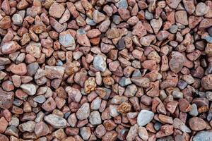 Smooth River Pebbles Forming a Natural Background photo