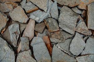 Geometric Stone Background Formed by Cut and Polished Rocks photo