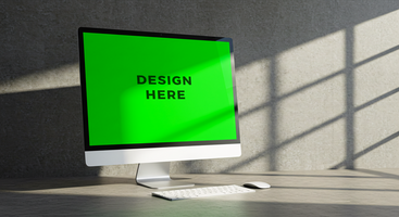 Computer monitor mockup with green screen displayed on textured concrete surface for branding media psd