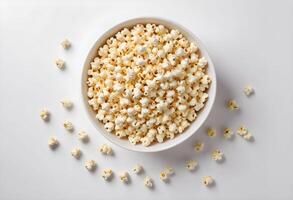 Overhead shot of a white bowl filled with popcorn photo