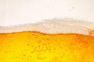 Close up bright orange Oil or beer splash texture and nature waves, Beautiful waves curve and little bubbles smooth for graphic design and background, Oil Bubble photo