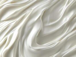 Smooth, flowing white fabric with elegant folds creates sense of luxury and softness photo