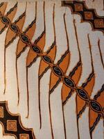 Batik pattern background. A close up of Javanese batik with a Parang Wenang pattern. Indonesian batik. photo
