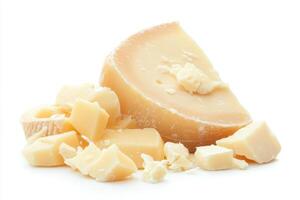 Cheese wedge and chunks displayed on white background photo