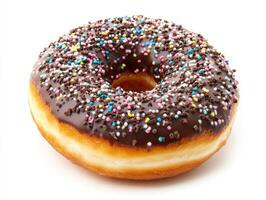 Chocolate donut coated with colorful sprinkles on a white background photo
