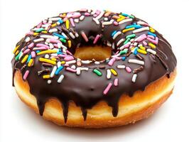 Chocolate donut with colorful sprinkles sits on a white background photo