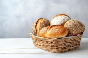 Freshly baked artisan bread in a woven basket on a wooden table photo