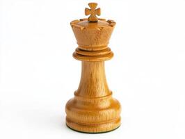 Wooden chess king piece stands alone on a clean surface photo