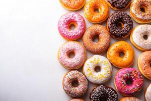 Colorful assortment of donuts on a white background photo