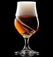 Craft beer served in an elegant glass with rich foam swirl photo