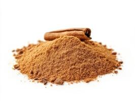 Cinnamon powder and stick displayed on a white background photo