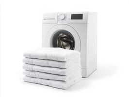 Washing machine with neatly stacked white towels at home photo