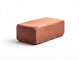 Red clay brick used in construction isolated on white photo