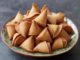Delicious fortune cookies arranged on a decorative plate photo