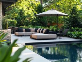 Luxurious outdoor lounging area with pool surrounded by greenery photo