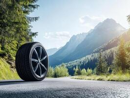 Mountain road with a single tire in a serene landscape setting photo