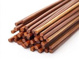 Wooden chopsticks arranged neatly for dining purposes photo