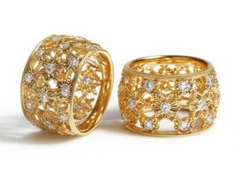 Elegant golden rings with intricate designs and sparkling stones photo