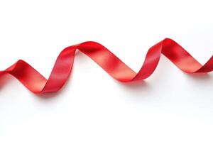 Wavy red ribbon on a white background for crafts and decorations photo