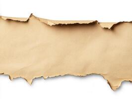 Torn brown paper with uneven edges revealing a clean white background photo