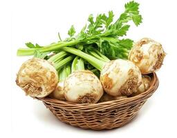 Fresh celery root and green celery in a woven basket photo
