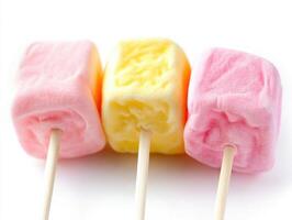 Colorful marshmallow treats on sticks ready for enjoyment photo