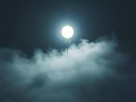 Illuminating moonrise above misty clouds at night sky photo