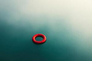 Lifebuoy floats on still water at dawn near a serene lakeside photo