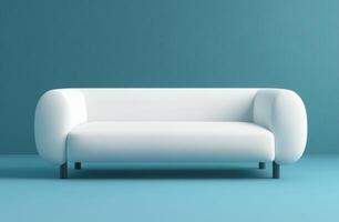 Modern white sofa against a blue wall in a minimalist setting photo