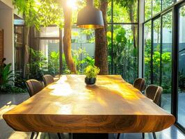 Sunlit dining area with large wooden table in a garden setting photo