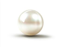 Natural pearl resting on a smooth surface with soft shadows photo