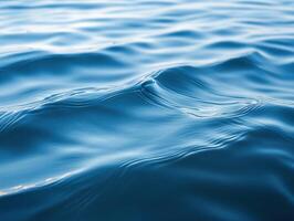 Rippling blue water surface on a calm day photo
