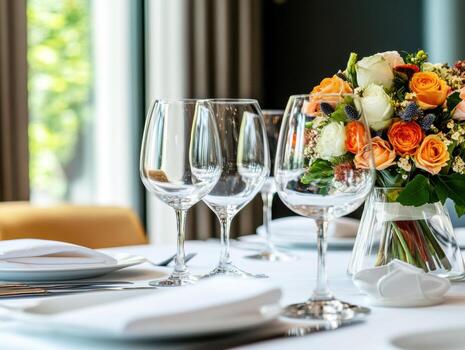 Elegant table setting with flowers and glassware for special occasion photo