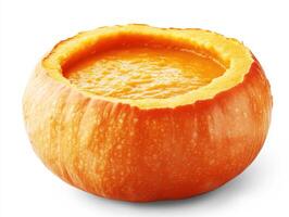 Pumpkin filled with creamy orange soup ready for autumn dining photo