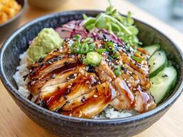 Grilled chicken rice bowl with fresh vegetables and sauce photo