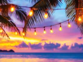 Colorful sunset with string lights over the ocean photo