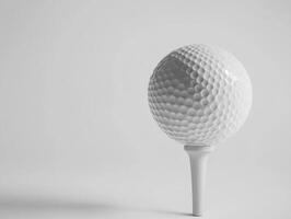 Golf ball on tee ready for a perfect shot during a calm day photo