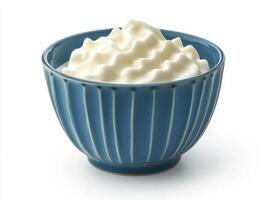Whipped cream served in a decorative blue bowl photo