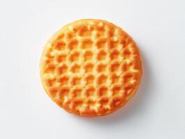 Warm and golden waffle placed against a plain background photo