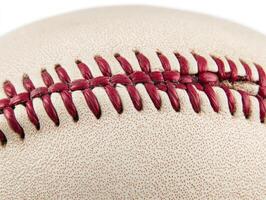 Close-up view of a baseball highlighting its stitching details photo
