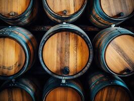 Wooden barrels arranged neatly in a rustic storage area photo