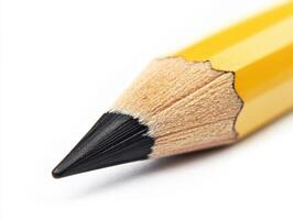 Close-up view of a sharpened yellow pencil with black lead tip photo