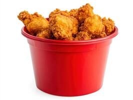 Crispy fried chicken in a red bucket ready for sharing photo