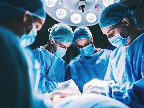 Surgeons performing a complex operation in a modern surgical theater photo