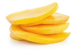 Fresh mango slices stacked on a white surface for a healthy treat photo
