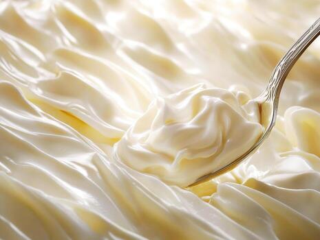 azotado crema con un cuchara en un suave superficie foto